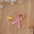Pin's ruban rose pailleté rosé cuivré